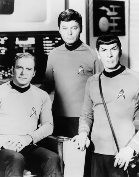 William Shatner, left, DeForest Kelley, center, and Leonard Nimoy pose on the set of the television series Star Trek in this undated photo.