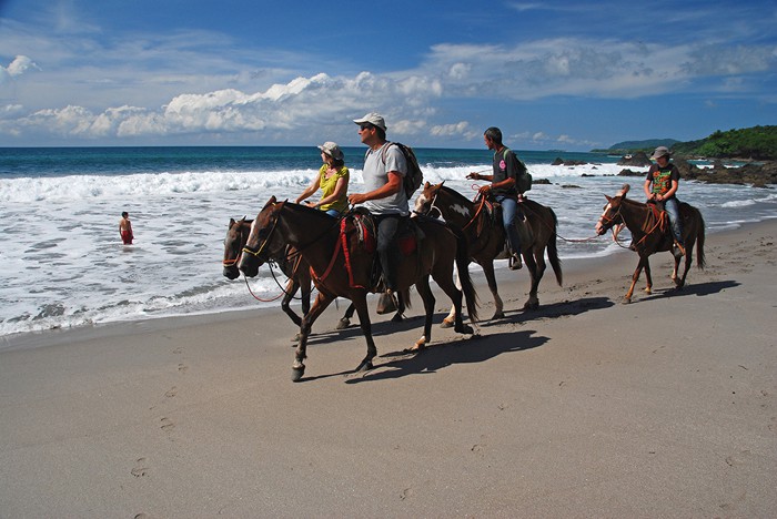 Horseback riding on the beach in Montezuma, Guanacaste.