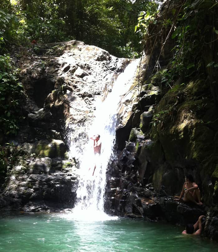 A man slides down the chute of Cascada Verde.