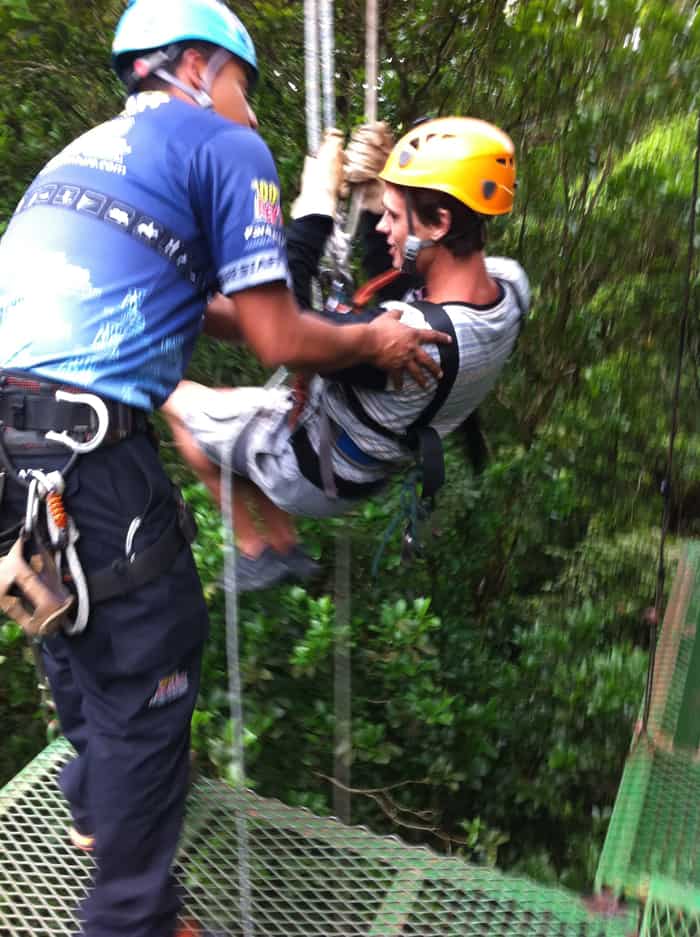 A visitor gets set for the vertical rappel.