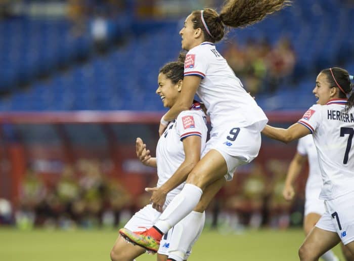 Costa Rica's Raquel Rodríguez, left, celebrates a goal against Spain with Carolina Venegas, center, and Melissa Herrera.