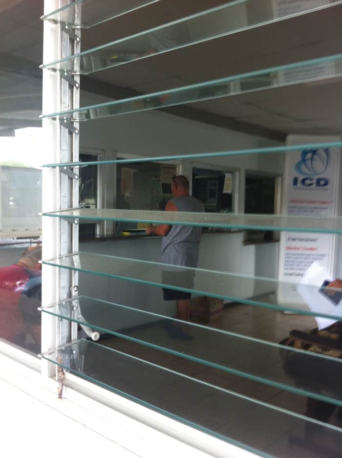 Paul waits at the window where you register cars.