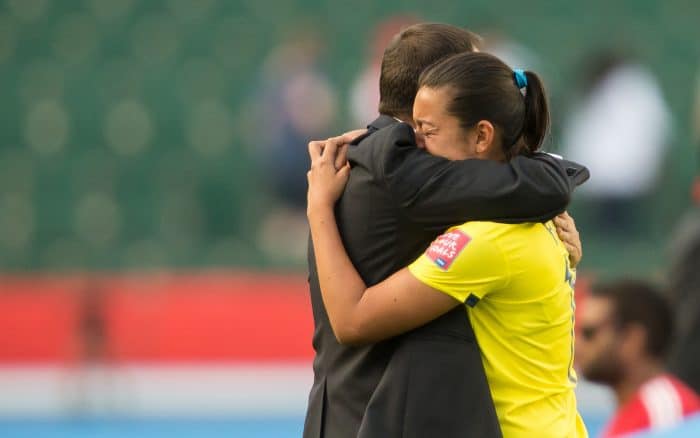Colombian head coach Fabian Taborda consoles Yoreli Rincón.