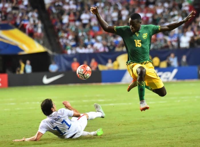 Jamaica's Je-Vaughn Watson (R) vies with Alejandro Bedoya of the U.S. during a CONCACAF Gold Cup semifinal football match.