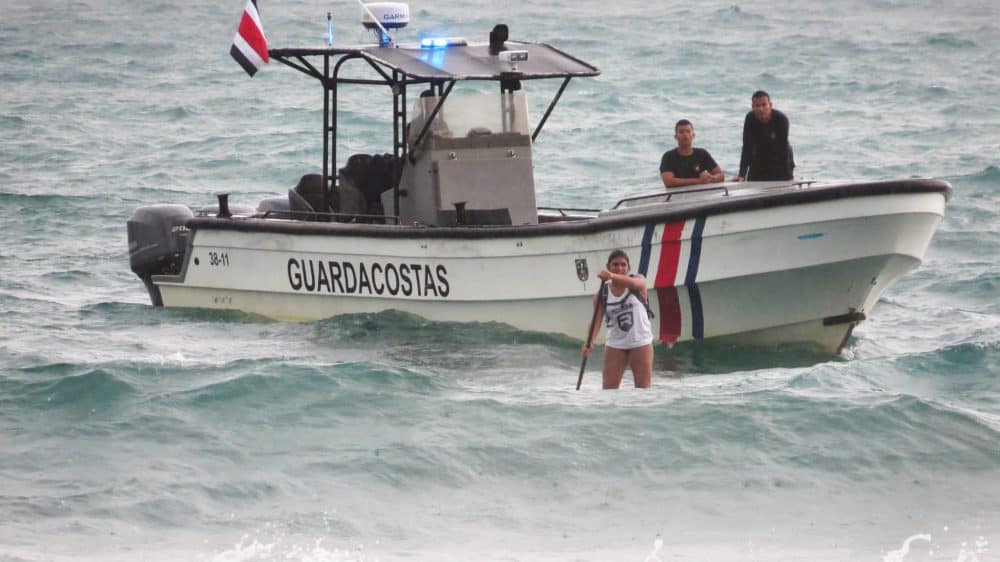 Valeria Salustri paddles into shore at Playitas, Manuel Antonio after battling severe weather and wave conditions, August 8, 2015. She won second place in the SUP Women's 9K national competition.