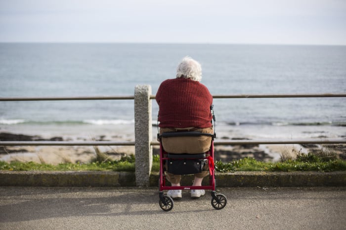A man looks out to sea in Falmouth, southwest England.