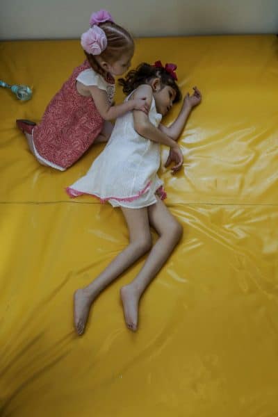 Valentina Elizalde, 2, left, with her sister Grace in the playroom of their house in Monterrey, Mexico, on August 12, 2015.