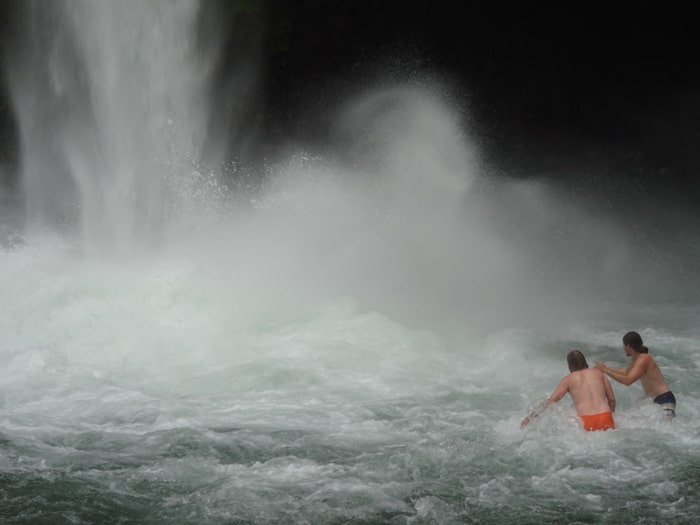 Aladdin and Orpheus brave the "wading pool" in front of La Fortuna waterfall.