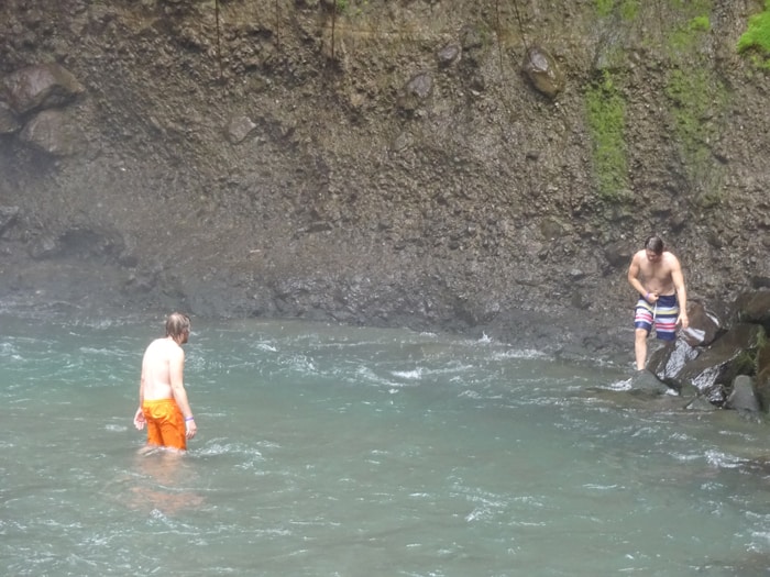 Orpheus, busted by the whistling lifeguard, makes his way back to safety along the right shore while Aladdin looks on.