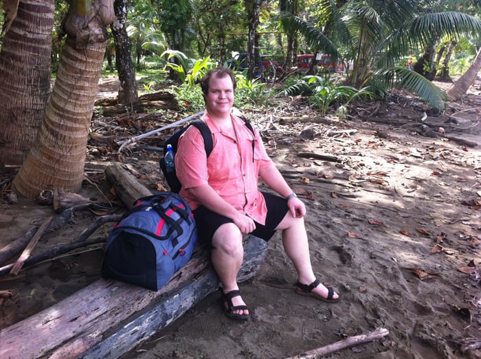 Jordan awaits boat pickup at Drake Bay.