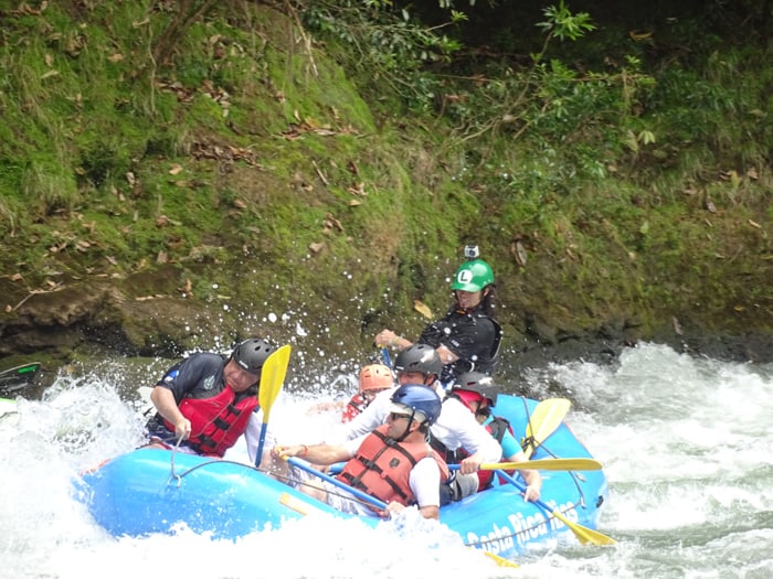 Costa Rican President Luis Guillermo Solís, left, rafts the Pacuare River.