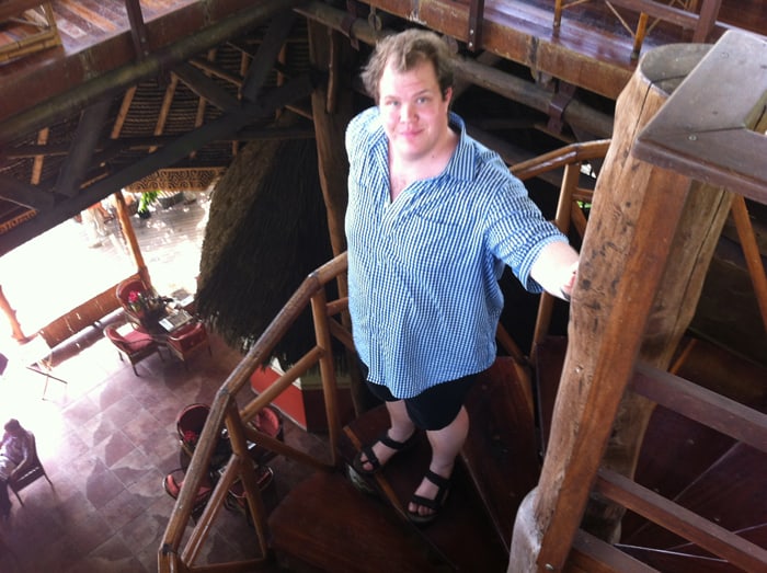 Jordan on the spiral stairs in the big rancho at Lapa Ríos.