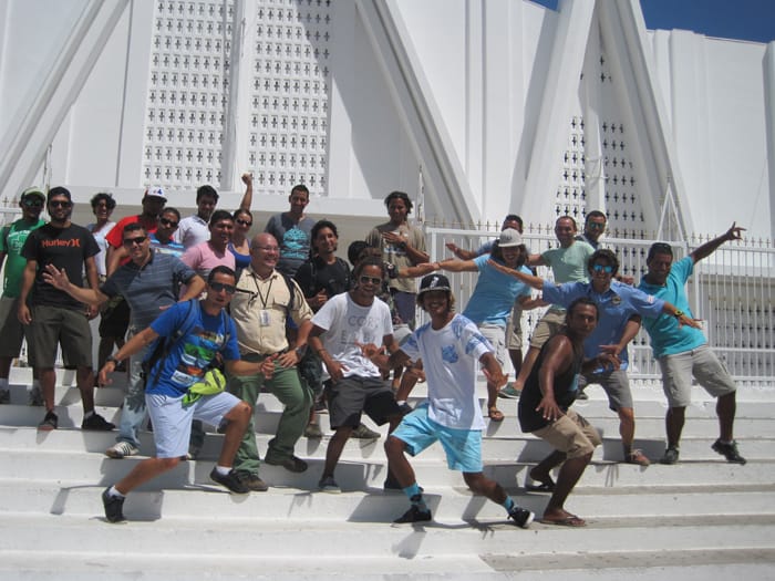 Student tour guides in front of church — pretending they are surfing.