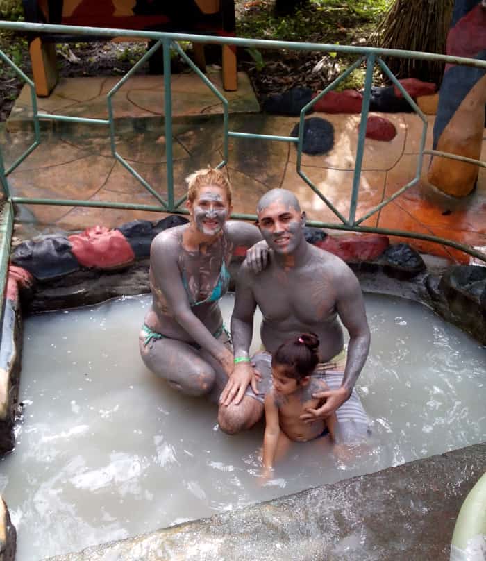 Looking a bit like the Blue Man Group, a family from Florida enjoys a mud path at Blue River Resort.