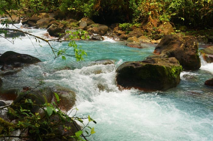 A hike down a private trail leads to views of Río Celeste like this one.