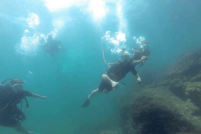 Snuba divers plunge into the water off Catalina Island.