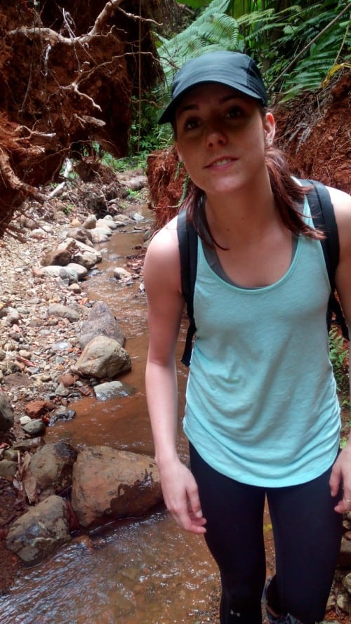 Mia hoofs it through the creek.