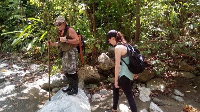 At Río Carate, Paul warns against slipping on rocks and breaking an ankle.