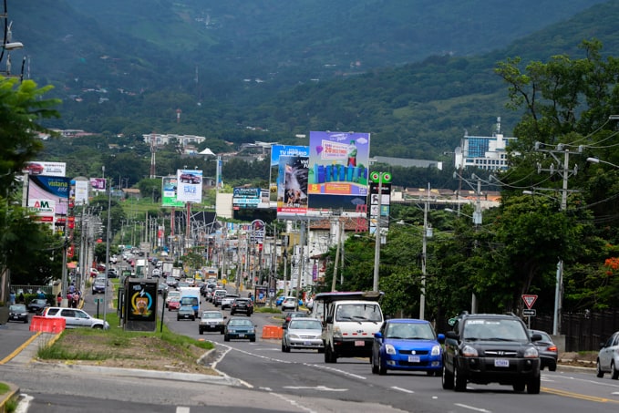 Traffic moves past the businesses on Lindora Road.