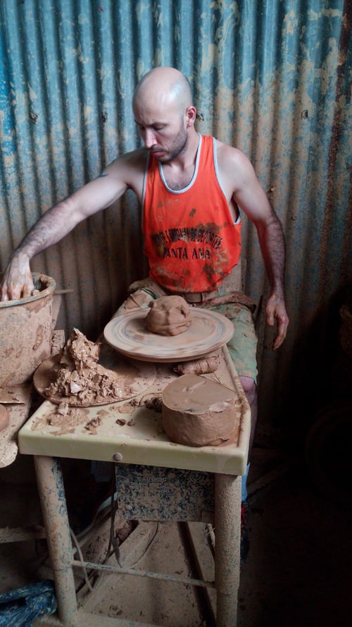 A raw piece of clay is ready to turn into the base for a pot.