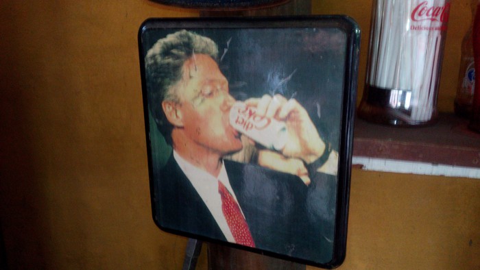 President Bill Clinton guzzles a Diet Coke.