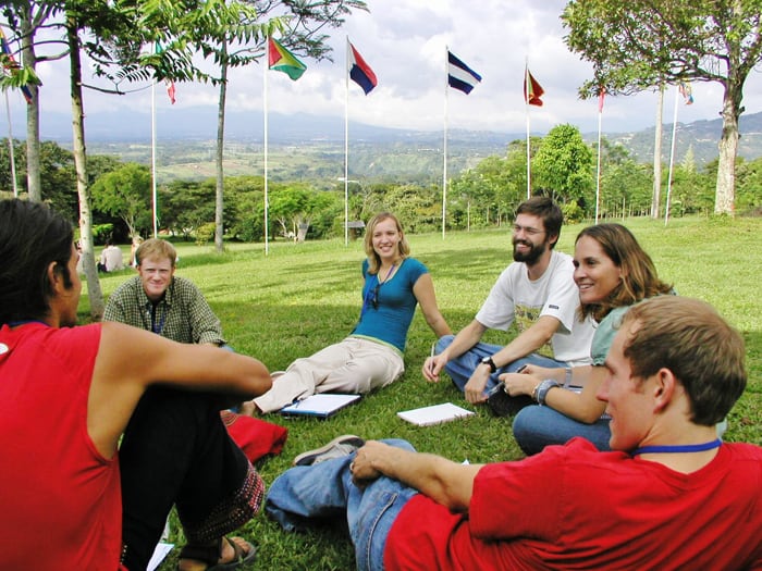 Students on the lawn in front of University for Peace.