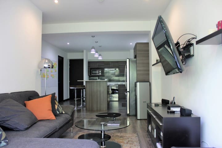 Living room at condo for rent at Nova Lofts.