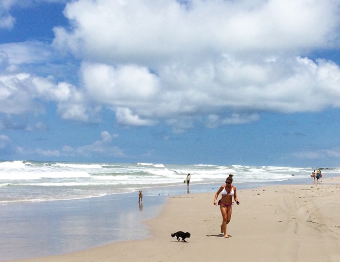 Cristina on Playa Carmen with our dogs.