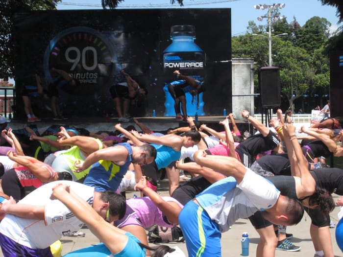 Crowds follow along as instructors demonstrate the moves.