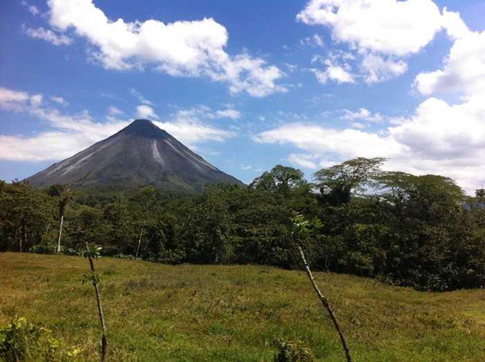 Roadside view of Volcán Arenal, a nearly perfect cone and the perfect backdrop for all kinds of adventure.