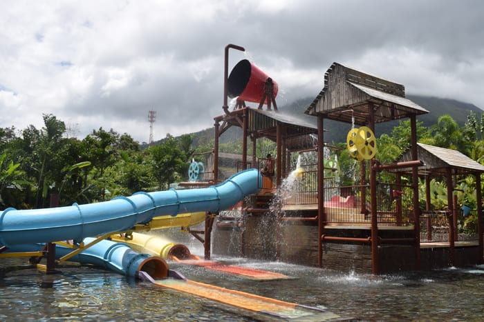 Some colorful fun, with a dumping water bucket, at Kalambu Hot Springs.