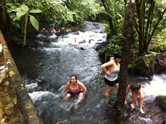 Visitors soak in the hot, free Río Chollín.