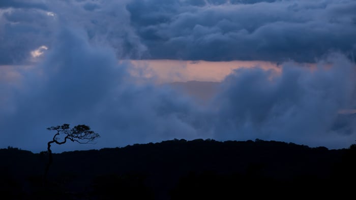 Sunset looking from Monteverde down to the Pacific, with the ocean in the background.