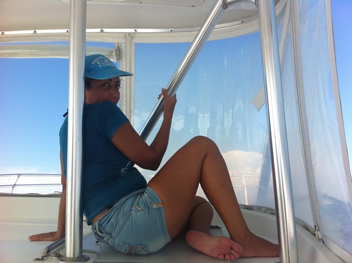 Guiselle, who refuses to use sunscreen because it feels "sticky," finds shelter from the sun.